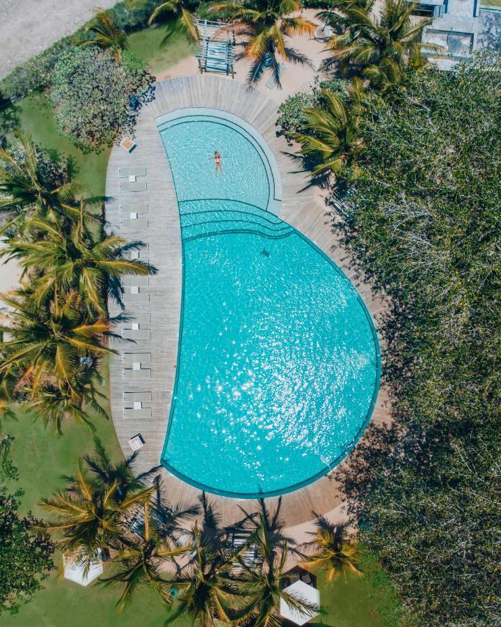 Lux* Grand Gaube Resort & Villas Exterior foto Aerial view of the pool at the 2019 World Championships
